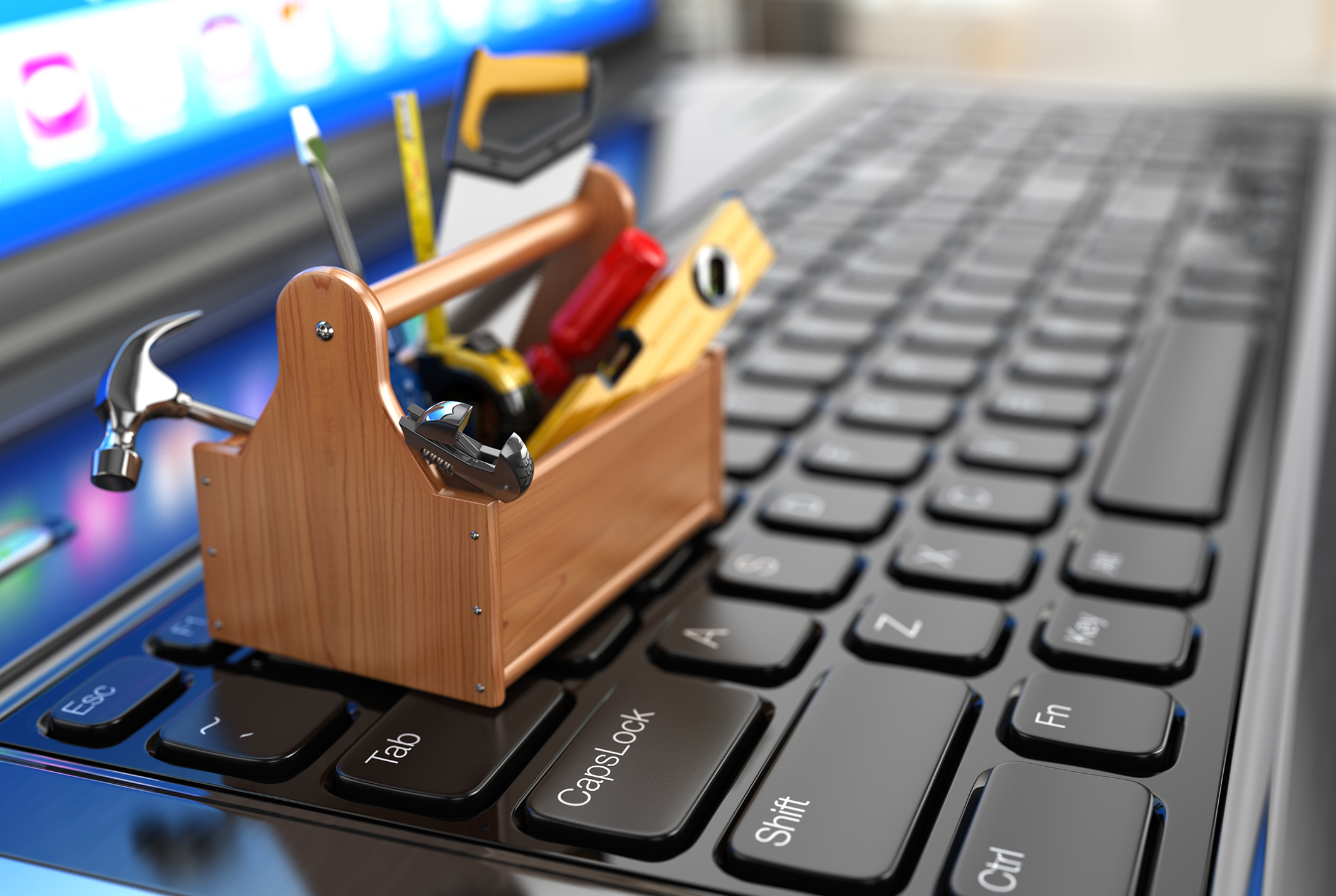 Image of a small tool box sitting on a laptop keyboard