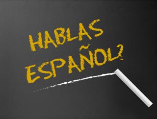 Image of Blackboard with Hablas Espanol? written on it.