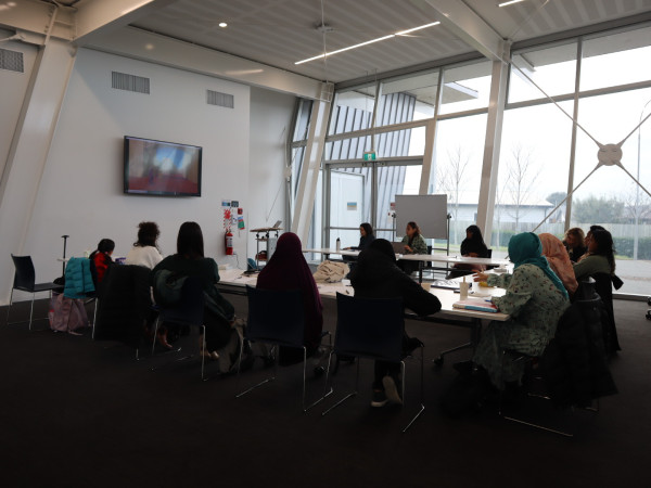 Women's leadership training - seated around the table.