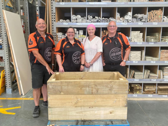 Tairāwhiti Multicultural Council and Bunnings staff with boxes used to protect local dairys